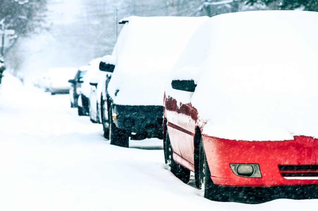 Parked Cars on a Snowstorm Winter Day