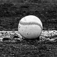 Baseball on a park pitchers mound black and white